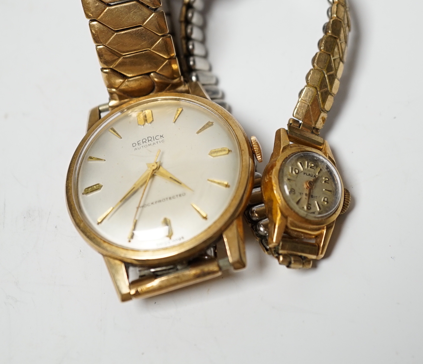 A lady's 18ct gold Plaza manual wind wrist watch, on a steel and gold plated flexible strap, together with a gentleman's 9ct gold Derrick automatic wrist watch, on a flexible strap.